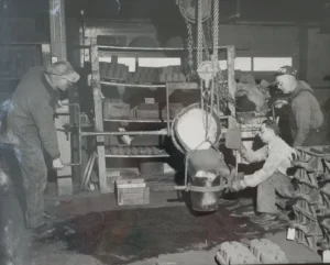 A black and white photo of Richards Foundry employees pouring metal